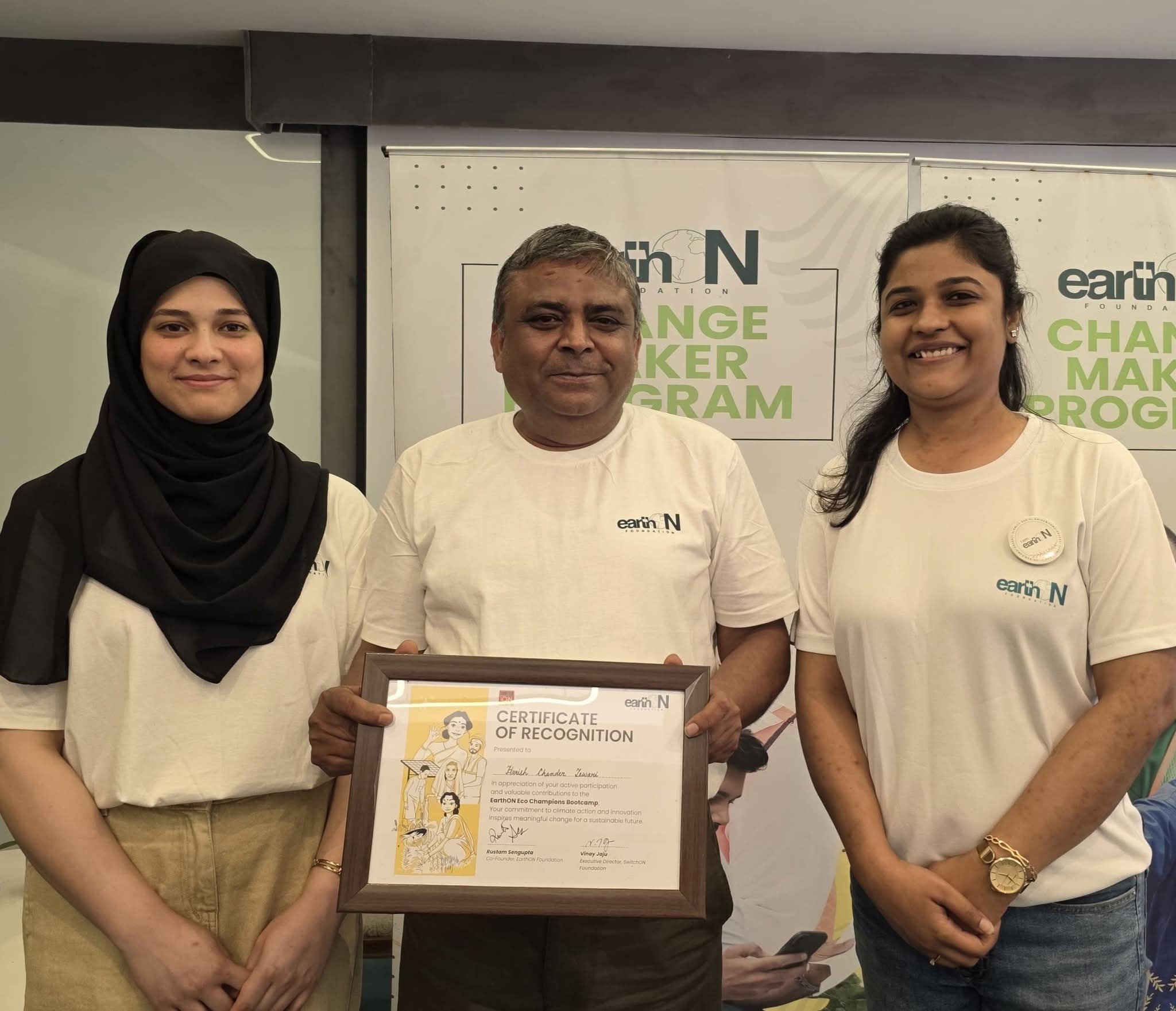 Harish Tewari receiving a certificate of recognition